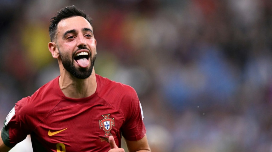 Fernandes double sends Portugal into World Cup knock-outs