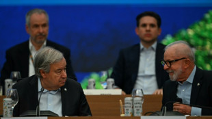 World leaders ditch ties at sweaty climate summit