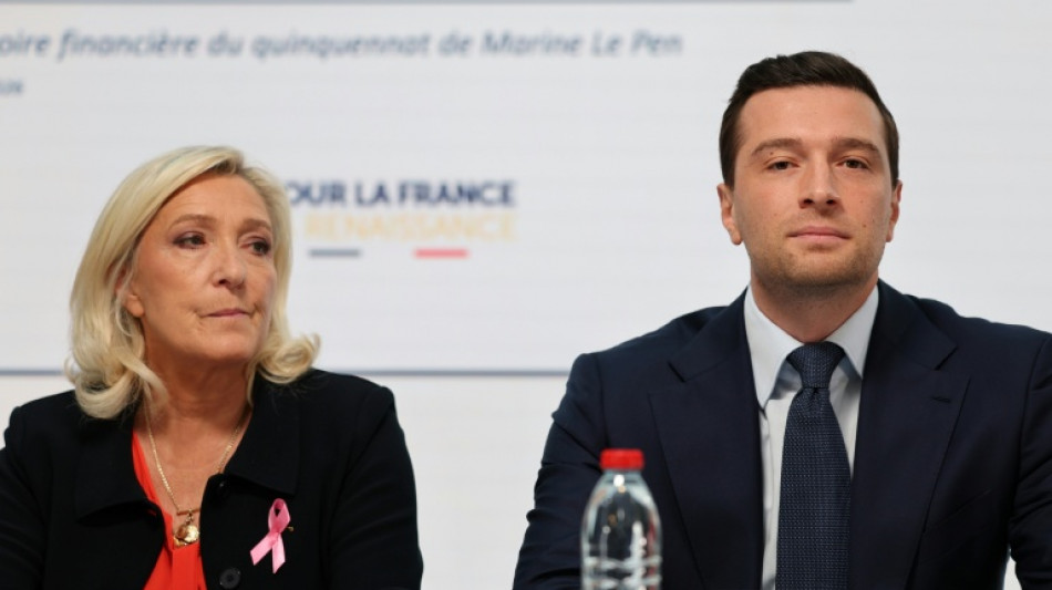 Le Pen vows drastic cost savings to prevent French 'default'