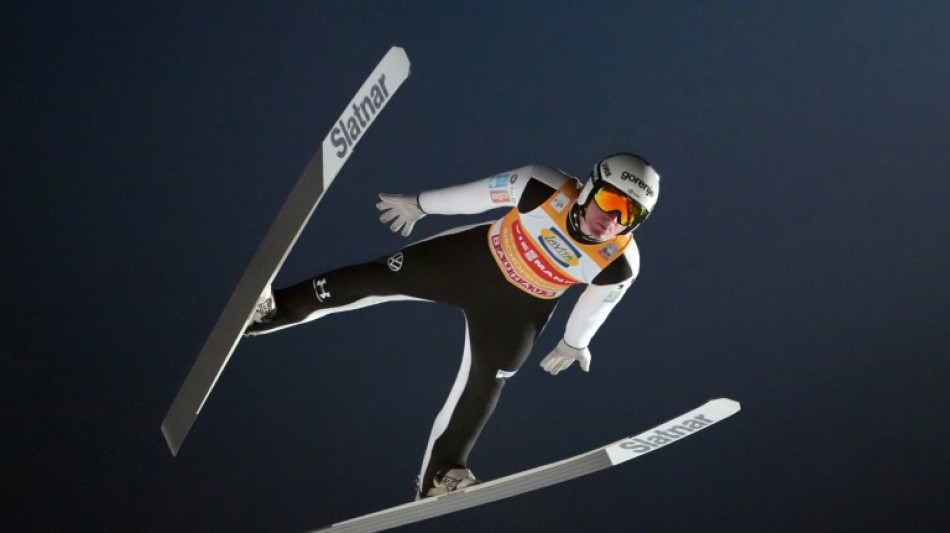 Domen Prevc soars to Four Hills ski jump title to emulate brother