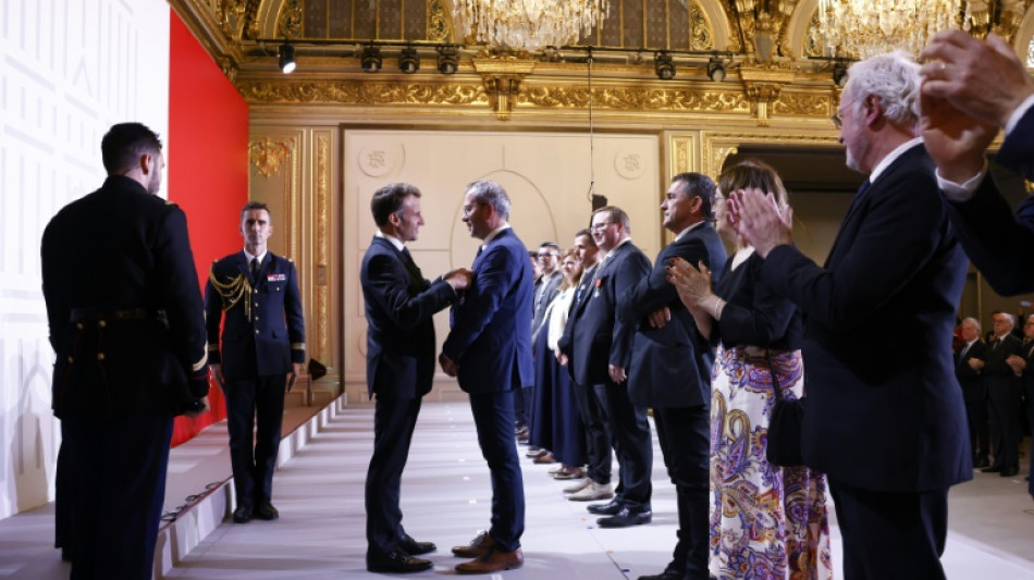 France's Macron honours craftspeople who rebuilt Notre Dame