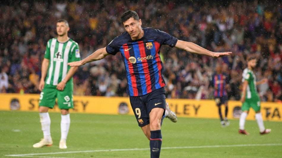 Barca thrash Betis to stay ahead of rampant Madrid