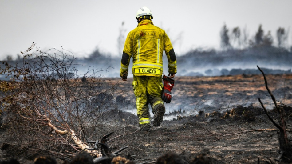 Belgian fire of the century 'encircled' but fight goes on