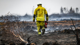 Belgian fire of the century 'encircled' but fight goes on