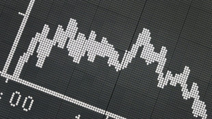 Global stocks slide as traders eye more US rate hikes